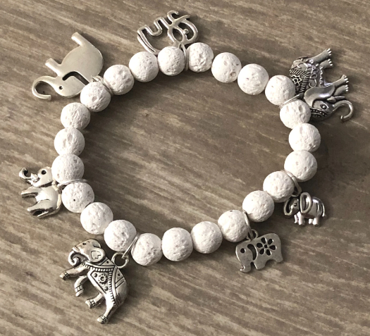 Charm bracelet with turtles and white lava beads