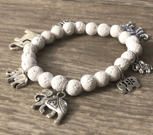 Charm bracelet with turtles and white lava beads