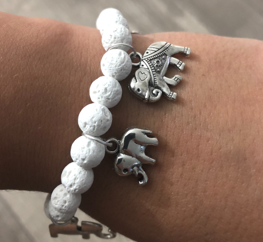 Charm bracelet with turtles and white lava beads