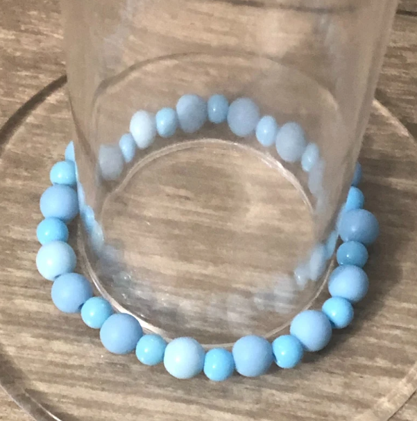 Blue beaded handmade stretch bracelet with round blue beads