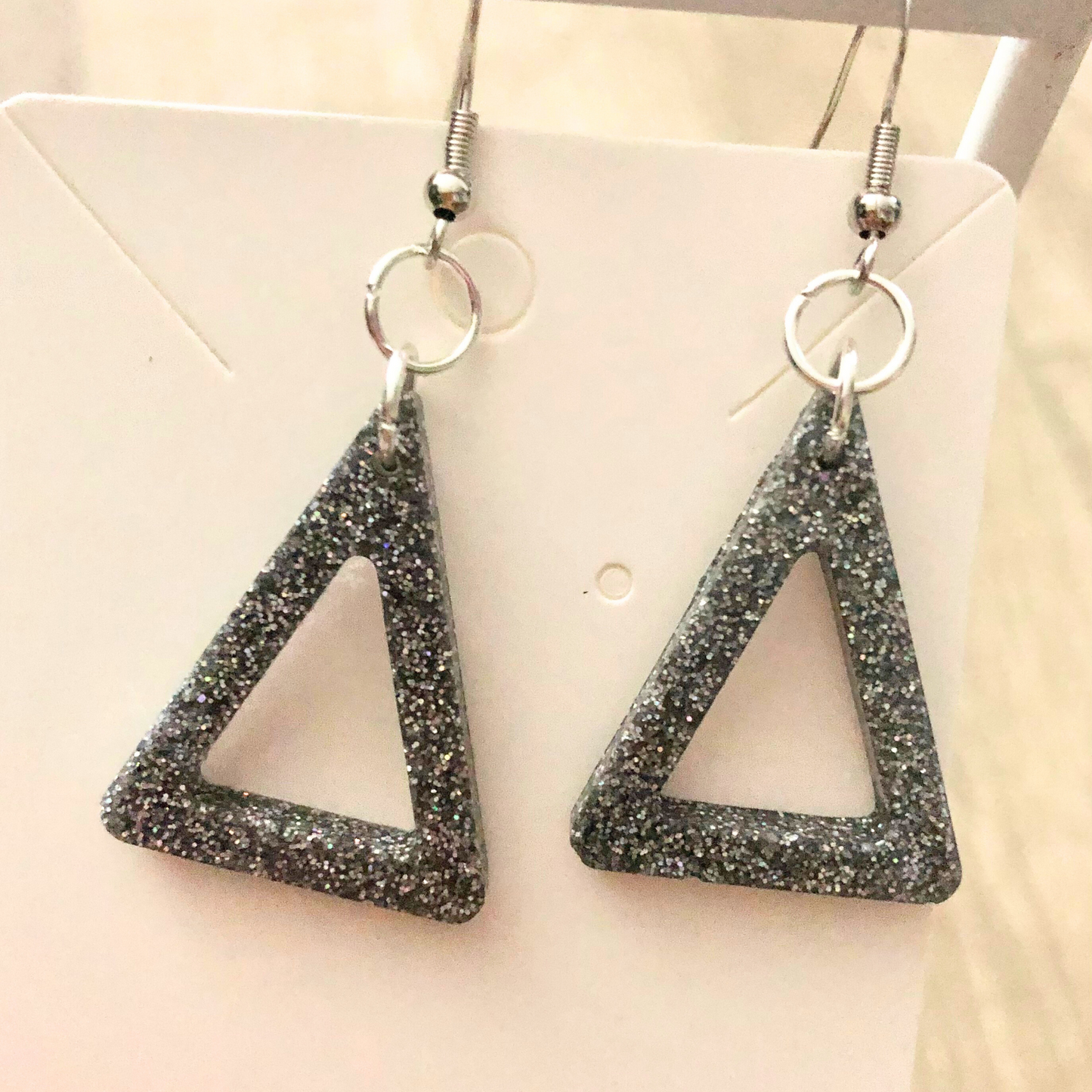 Silver glitter dangling earrings handmade with clear resin