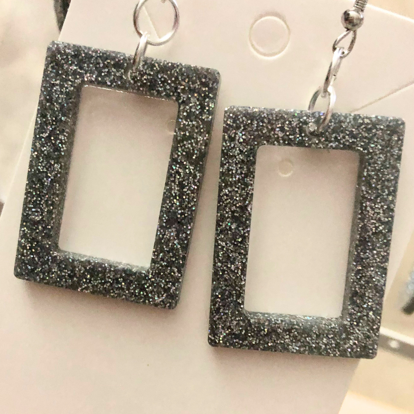 Silver glitter dangling earrings handmade with clear resin