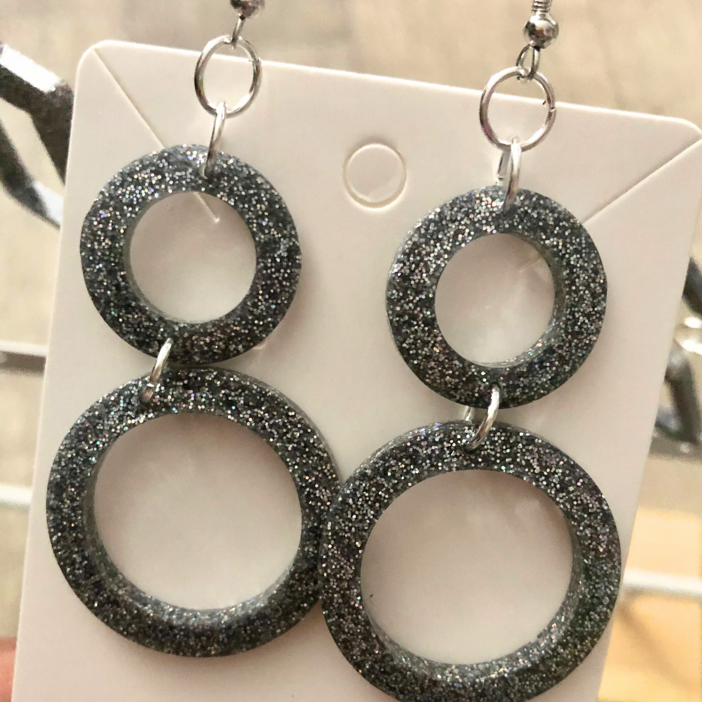 Silver glitter dangling earrings handmade with clear resin