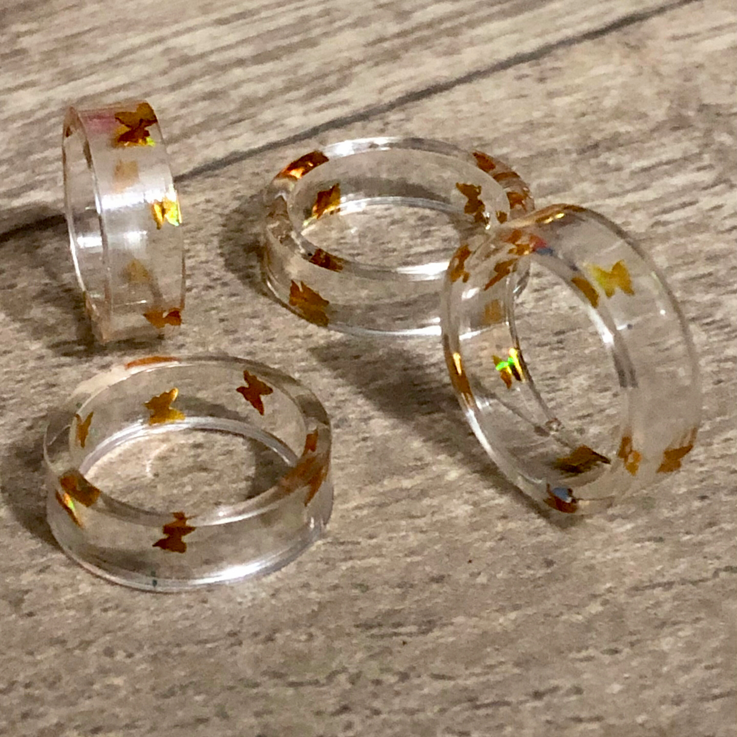 Handmade jewelry set made with clear UV resin and gold butterflies