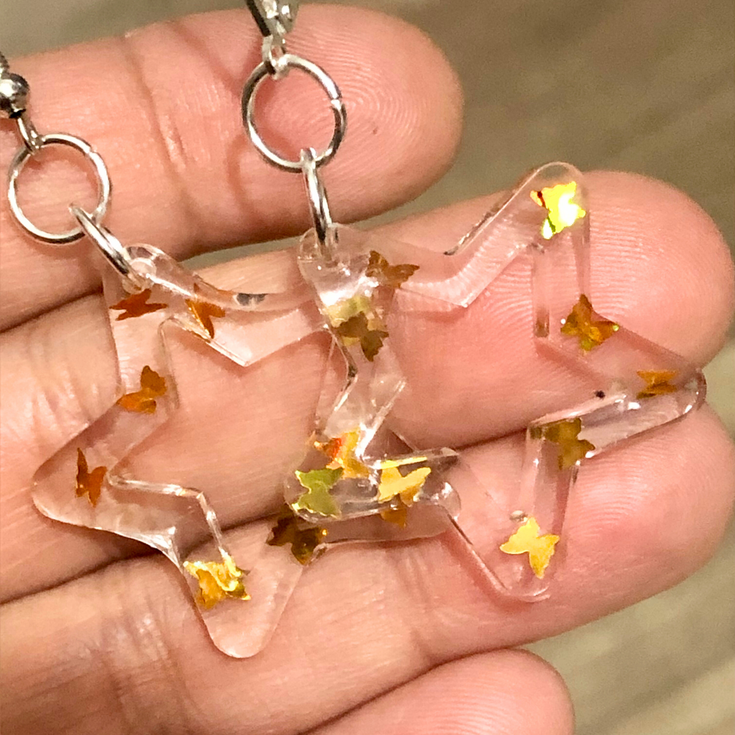 Handmade jewelry set made with clear UV resin and gold butterflies