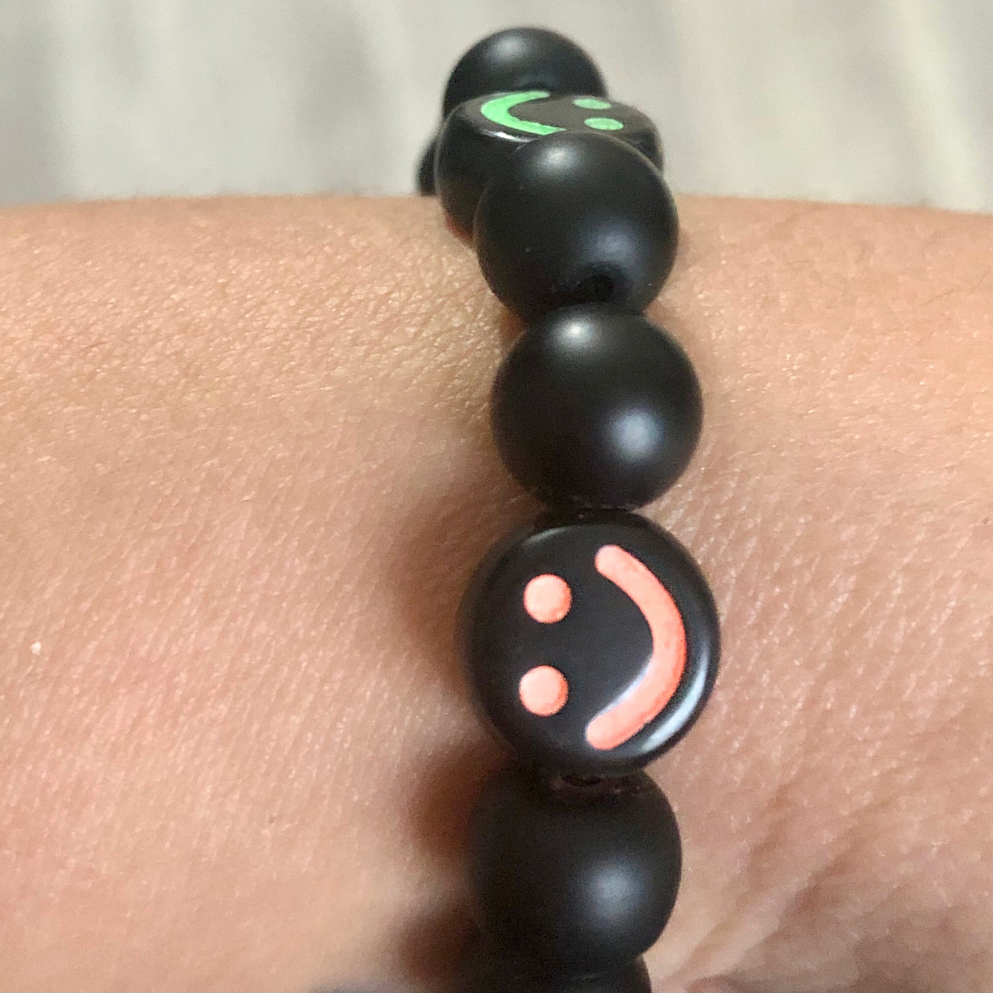 Smiley face bracelet handmade with black beads and elastic cord