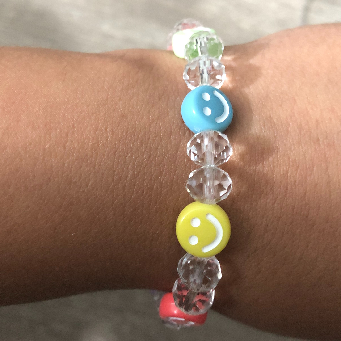 Colorful bracelet handmade with crystal beads and smiley faces