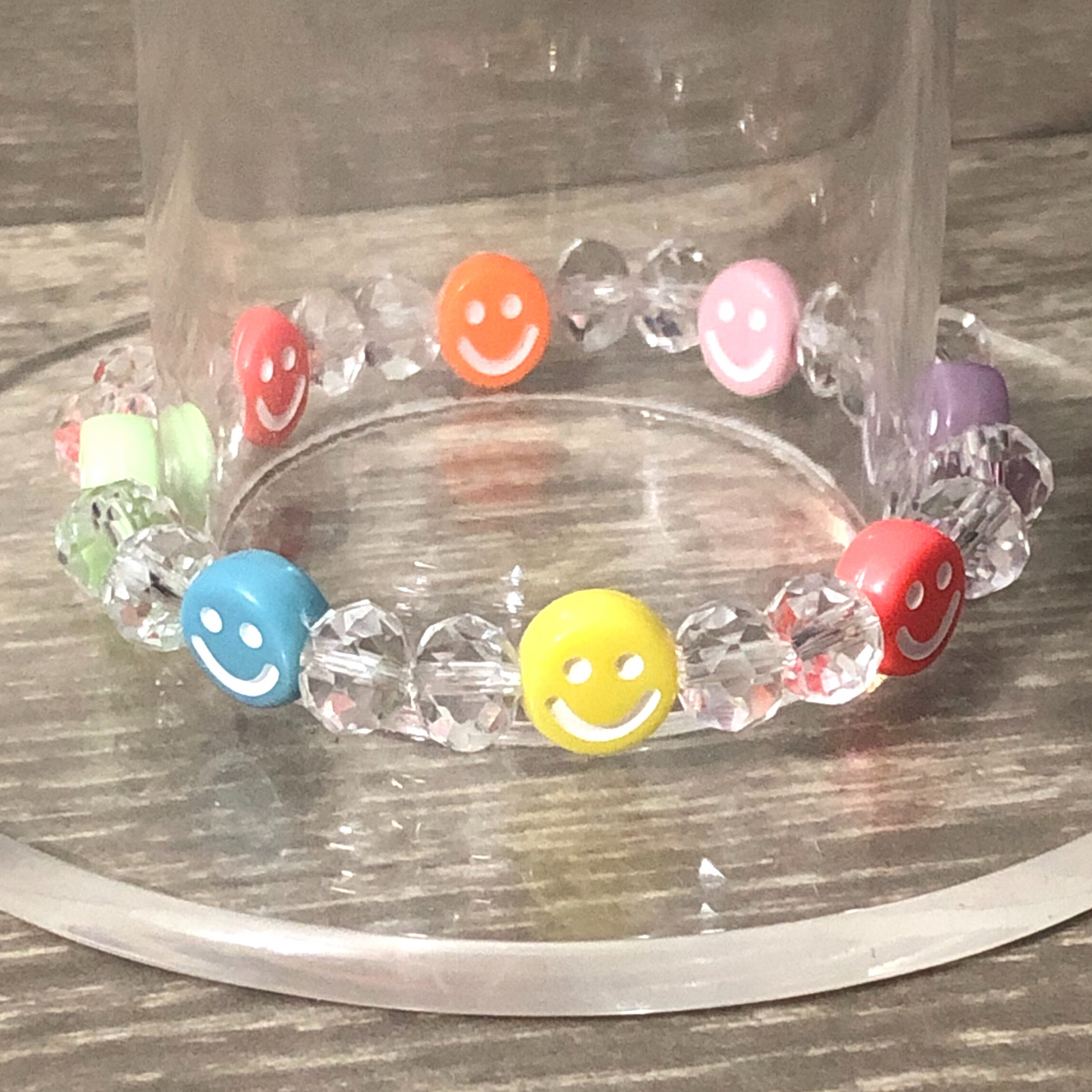 Colorful bracelet handmade with crystal beads and smiley faces