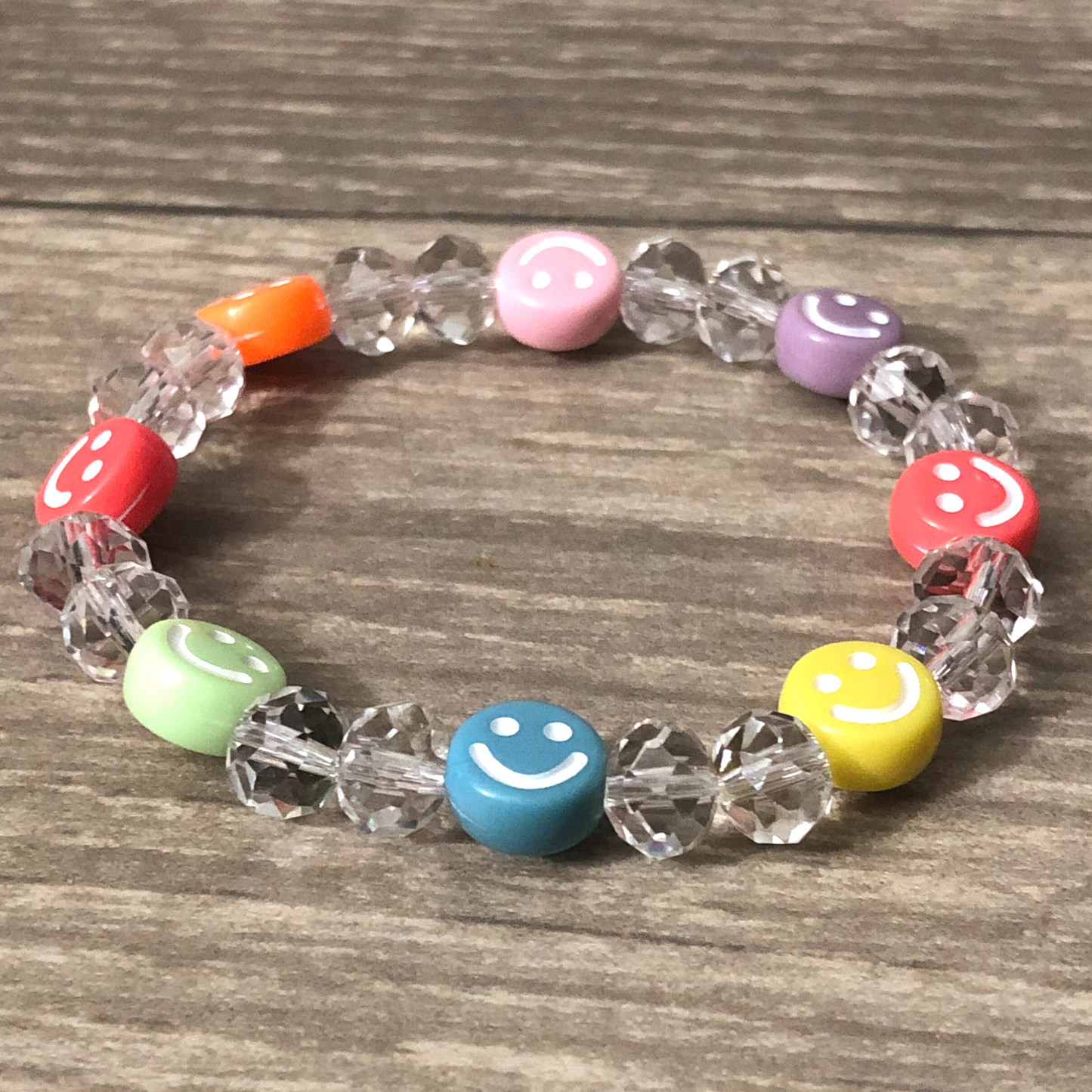 Colorful bracelet handmade with crystal beads and smiley faces