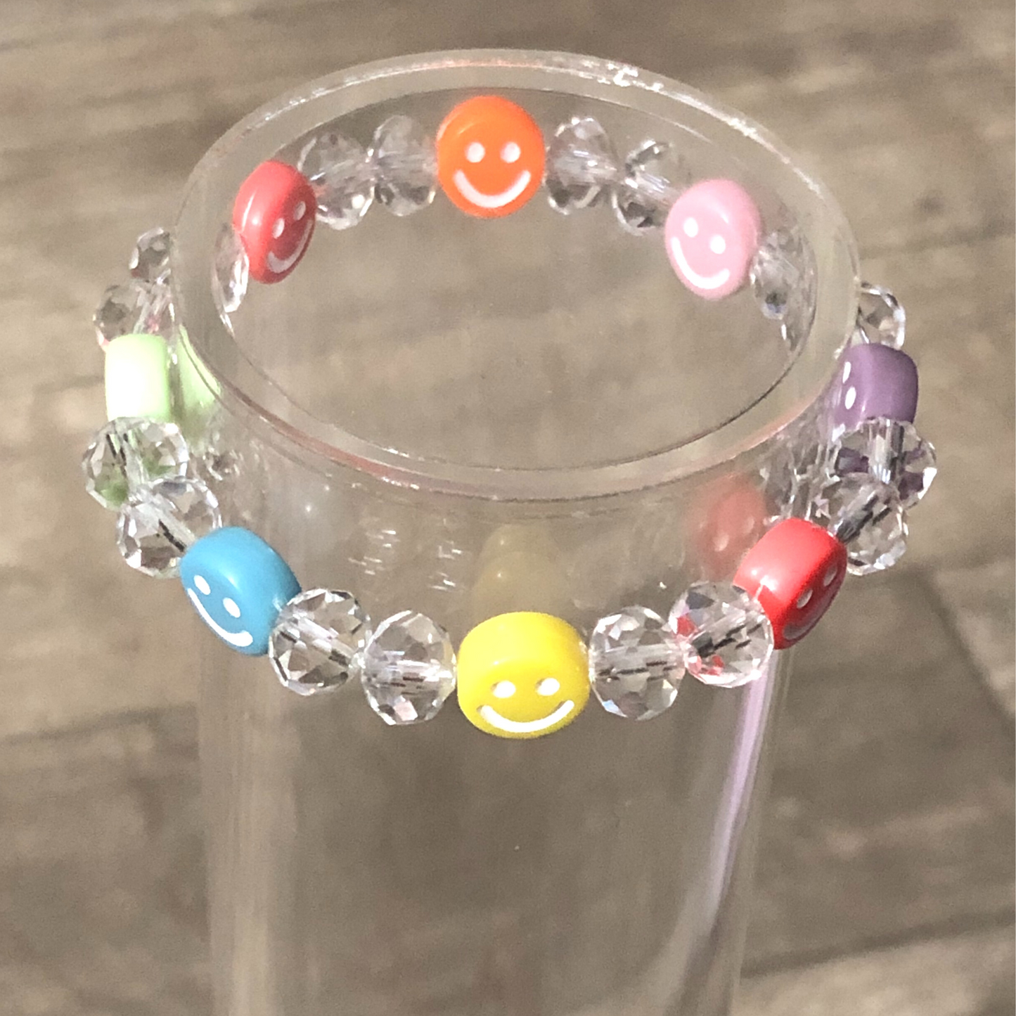 Colorful bracelet handmade with crystal beads and smiley faces