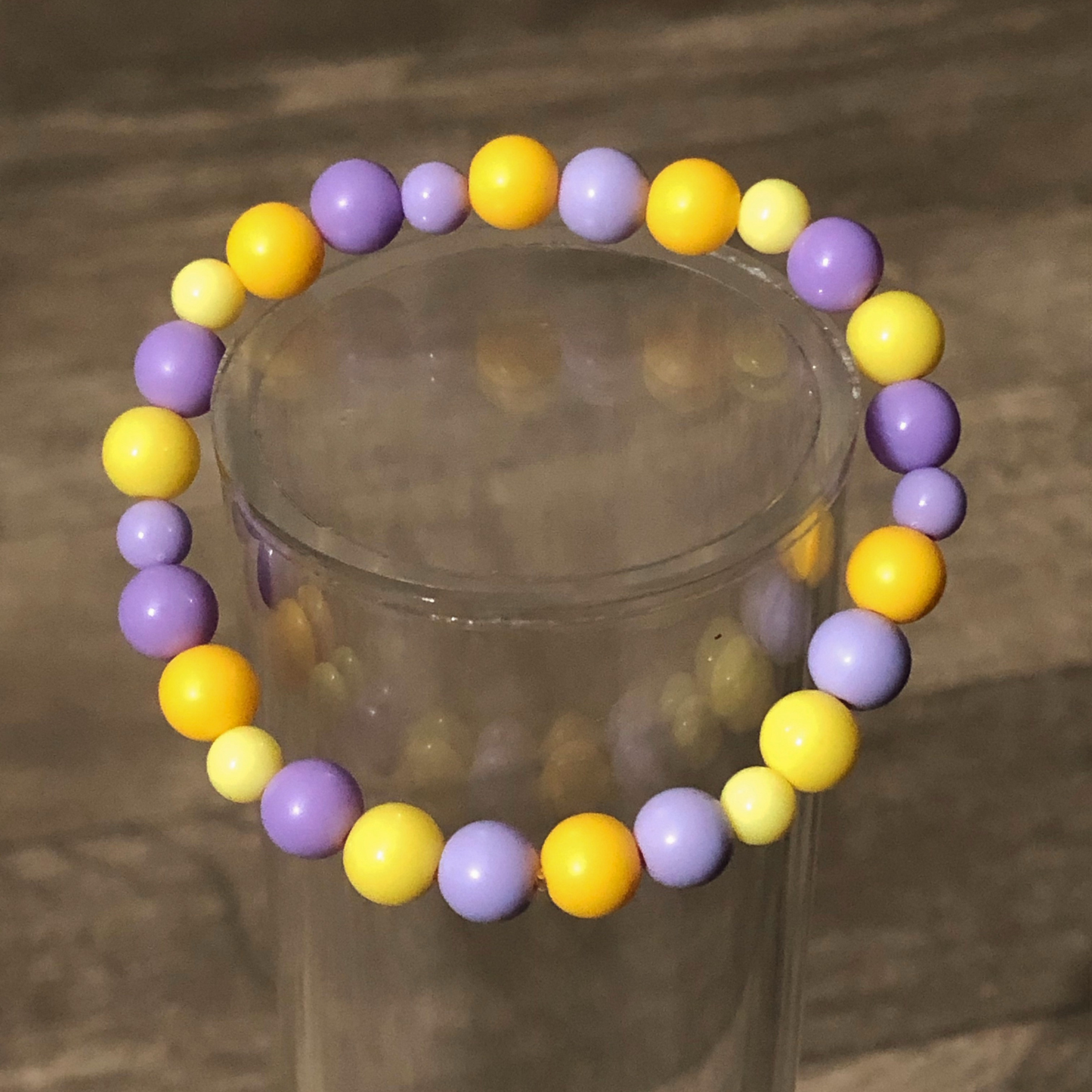 Purple and yellow beaded stretch bracelet available now