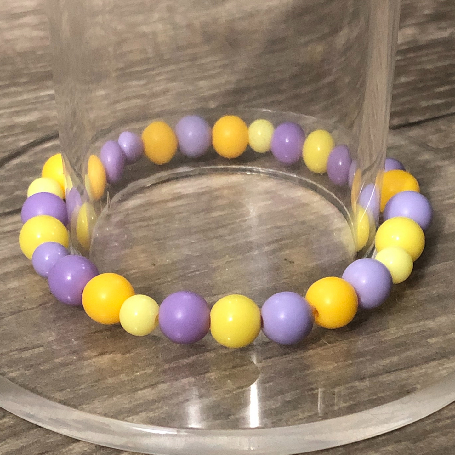 Purple and yellow beaded stretch bracelet available now