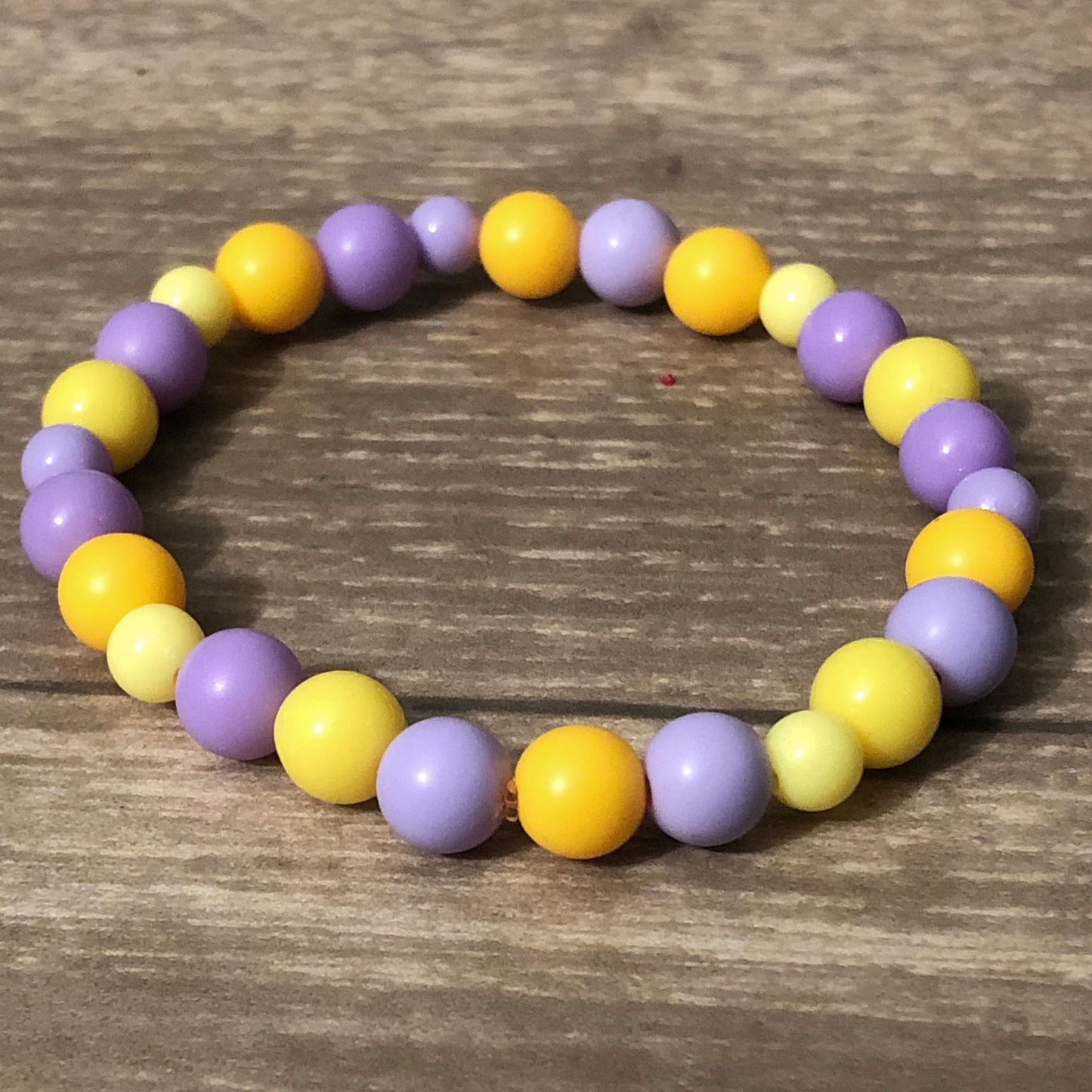 Purple and yellow beaded stretch bracelet available now